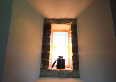 Unusual little window with a light in, in the Wheel House