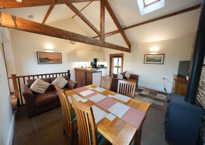 Another view of the Apple Loft including kitchen, table, comfy seating