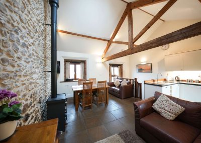 Whole Area including the logburner in the Apple Loft